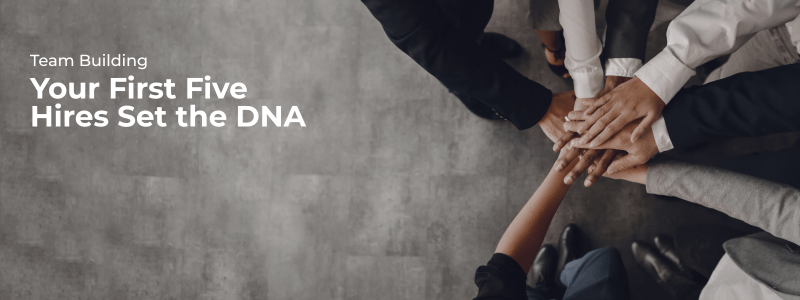 Founders joining hands in a circle, symbolizing trust, collaboration, and early-stage team alignment.